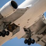Detailed view of airplane undercarriage during takeoff at Santiago, Chile airport.